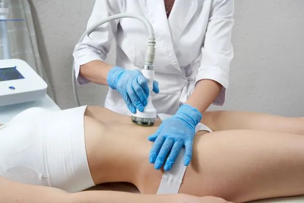 Lost the Weight but Not the Loose Skin? 2 woman having HIFU treatment on her stomach to combat loose skin Buckingham following weight loss